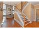 Elegant staircase with hardwood treads and white railings at 1553 Rolling Meadows Dr, Mcdonough, GA 30253