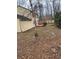 A view of the home's backyard with a deck and wooded area at 216 Ridgedale Way, Lawrenceville, GA 30044