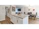 Kitchen island with granite countertop, seating, and hardwood floors at 5400 Roswell Rd # E2, Atlanta, GA 30342