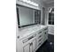 Elegant bathroom with double vanity and black accents at 911 David Dr, Lawrenceville, GA 30046