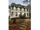 Stunning two-story home with white exterior and black accents at 911 David Dr, Lawrenceville, GA 30046