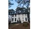Two-story house with white siding, black trim, and dormer windows at 911 David Dr, Lawrenceville, GA 30046