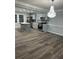 Open concept kitchen with gray cabinets, breakfast bar, and updated appliances at 911 David Dr, Lawrenceville, GA 30046