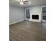 Living room with hardwood floors, a fireplace, and plenty of natural light at 911 David Dr, Lawrenceville, GA 30046