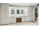 Double vanity bathroom with white cabinets and marble counters at 213 Pine Crest Dr, Cumming, GA 30040