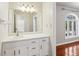 Clean bathroom with white vanity and a mirrored medicine cabinet at 213 Pine Crest Dr, Cumming, GA 30040