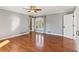 Bright bedroom with hardwood floors and an arched window at 213 Pine Crest Dr, Cumming, GA 30040
