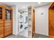 Large closet with built-in shelving, drawers, and washer/dryer at 213 Pine Crest Dr, Cumming, GA 30040