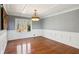Formal dining room with hardwood floors and wainscoting at 213 Pine Crest Dr, Cumming, GA 30040
