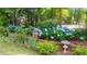 Landscaped garden with brick wall, hydrangeas, and bird bath at 213 Pine Crest Dr, Cumming, GA 30040