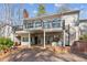 Two-story house with large deck, spiral staircase, and lake view at 213 Pine Crest Dr, Cumming, GA 30040