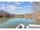 Calm lake view from a pontoon boat on a sunny day at 213 Pine Crest Dr, Cumming, GA 30040