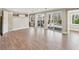 Bright and airy living room with wood floors, large windows, and access to outdoor space at 213 Pine Crest Dr, Cumming, GA 30040