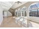 Sunlit living room with vaulted ceilings, fireplace, and access to a deck at 213 Pine Crest Dr, Cumming, GA 30040