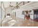 Spacious living room with hardwood floors, fireplace and kitchen views at 213 Pine Crest Dr, Cumming, GA 30040