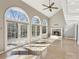 Living room with wall of windows, hardwood floors and a fireplace at 213 Pine Crest Dr, Cumming, GA 30040