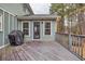 Wooden back porch featuring wood railings and a covered grill at 3521 Southern Bay Ct, Snellville, GA 30039