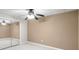 Bedroom features a ceiling fan, a large closet with mirrored doors, and neutral-colored walls and carpet at 3521 Southern Bay Ct, Snellville, GA 30039