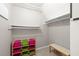 Organized closet space with shelves and colorful storage bins at 3521 Southern Bay Ct, Snellville, GA 30039