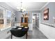 Cozy dining area featuring a vintage table set, light gray walls and wainscoting at 3521 Southern Bay Ct, Snellville, GA 30039