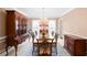 Spacious dining room with classic wood furnishings, chandelier, and abundant natural light at 3521 Southern Bay Ct, Snellville, GA 30039
