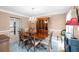 Formal dining room featuring a chandelier, wood table with seating for six and crown molding at 3521 Southern Bay Ct, Snellville, GA 30039