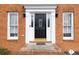 Elegant front door surrounded by sidelights and decorative trim, set in classic brick facade at 3521 Southern Bay Ct, Snellville, GA 30039