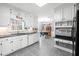 Bright kitchen featuring white cabinets, stainless steel appliances, and granite countertops at 3521 Southern Bay Ct, Snellville, GA 30039