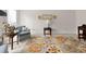 Inviting living room showcasing armchairs, flower-patterned rug, and neutral wall decor at 3521 Southern Bay Ct, Snellville, GA 30039