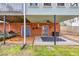 Covered patio made of brick and concrete featuring an outdoor ceiling fan and a grey rug at 3521 Southern Bay Ct, Snellville, GA 30039
