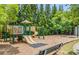 Community playground featuring swings and slides amidst a wooded area at 4850 Wilshire Xing, Cumming, GA 30040