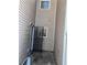 Narrow backyard space with tan siding and security door at 11329 Michelle Way, Hampton, GA 30228