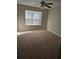 Bedroom features neutral walls, plush carpet, and bright natural light at 11329 Michelle Way, Hampton, GA 30228