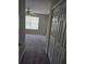 Bedroom boasts carpeting, ceiling fan, and natural light from the window at 11329 Michelle Way, Hampton, GA 30228