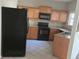 This kitchen is equipped with stainless steel appliances and granite countertops at 11329 Michelle Way, Hampton, GA 30228