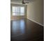 Spacious living room with a ceiling fan and hardwood floors at 11329 Michelle Way, Hampton, GA 30228