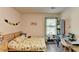 Well-lit bedroom featuring a desk and bookshelf at 1816 Hamilton Lake Pkwy, Buford, GA 30519