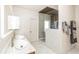 Luxurious bathroom with double vanity, marble shower, and wood ceiling at 3184 Paces Mill Se Rd, Atlanta, GA 30339