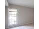 Carpeted bedroom with a large window at 3091 Colonial Way # C1, Atlanta, GA 30341