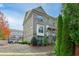 Brick front exterior of a three-story townhome with landscaping at 4249 Tacoma Trce, Suwanee, GA 30024