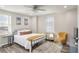 Comfortable bedroom with queen bed, hardwood floors, and large windows at 300 Peachtree Ne St # 3B, Atlanta, GA 30308