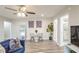 Bright dining area with white table and chairs, hardwood floors at 300 Peachtree Ne St # 3B, Atlanta, GA 30308