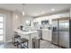 Modern kitchen with white cabinets, stainless steel appliances, and quartz countertops at 300 Peachtree Ne St # 3B, Atlanta, GA 30308