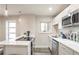 Modern kitchen with white cabinets, stainless steel appliances, and breakfast bar at 300 Peachtree Ne St # 3B, Atlanta, GA 30308