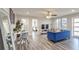 Open concept living room and kitchen with hardwood floors and stylish furniture at 300 Peachtree Ne St # 3B, Atlanta, GA 30308