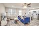 Open concept living room, kitchen and breakfast bar with hardwood floors at 300 Peachtree Ne St # 3B, Atlanta, GA 30308