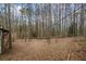 Wooded backyard with a mostly flat yard at 7037 Shangrila Trl, Riverdale, GA 30296