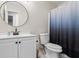 Clean bathroom with white vanity, updated fixtures, and a shower at 7037 Shangrila Trl, Riverdale, GA 30296