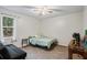 Bedroom with a full-size bed and window at 7037 Shangrila Trl, Riverdale, GA 30296
