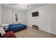Bedroom with a queen-size bed and a window at 7037 Shangrila Trl, Riverdale, GA 30296